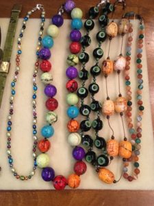 Pearl-knotted necklaces