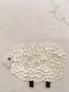 The finished sheep. I like the look of using beads for the face. The two different textures work well together, imho.